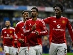Manchester United's Amad Diallo celebrates scoring their first goal with Kobbie Mainoo