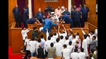 Congress MLA Tara prasad Bahinipati climbs on the Speaker's podium along with other Congress and BJD MLAs in a protest demanding caste-based census during ongoing Budget session of Assembly, in Bhubaneswar, Tuesday, Aug. 27, 2024. (PTI Photo) (PTI)