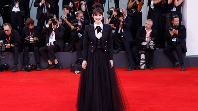 Winona Ryder opted for a frothy skirt with a sharp preppy blazer and waistcoat. Winona Ryder opted for a frothy skirt with a sharp preppy blazer and waistcoat. 