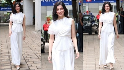 Divya Khosla Kumar nails the all-white look with effortless flair. She wore a white ruffle top paired with matching loose-fitted pants, styled with diamond stud earrings and white flats, radiating pure elegance. (Instagram) Divya Khosla Kumar nails the all-white look with effortless flair. She wore a white ruffle top paired with matching loose-fitted pants, styled with diamond stud earrings and white flats, radiating pure elegance. (Instagram)