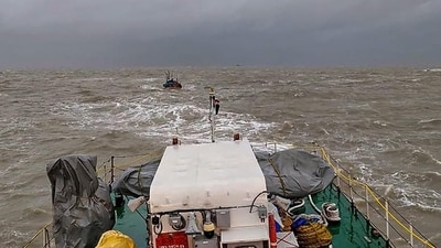 An Indian Coast Guard ship tows boat ‘Padmawati’ to safety after it drifted into the sea due to rough weather conditions off the Dwarka coast in Gujarat. (PTI Photo) An Indian Coast Guard ship tows boat ‘Padmawati’ to safety after it drifted into the sea due to rough weather conditions off the Dwarka coast in Gujarat. (PTI Photo)