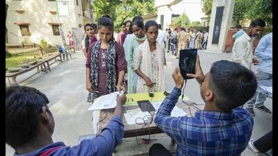 Candidates undergo identity verification at an examination centre before they appear for the UP police recruitment examination, in Lucknow, Friday. (PTI Photo) Candidates undergo identity verification at an examination centre before they appear for the UP police recruitment examination, in Lucknow, Friday. (PTI Photo)