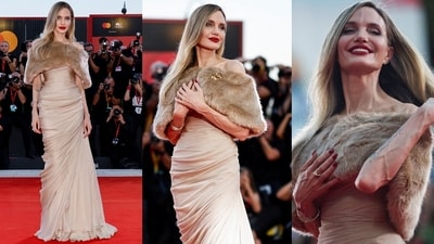 Angelina Jolie attends the Venice Film Festival 2024 wearing a Tamara Ralph number. Angelina Jolie attends the Venice Film Festival 2024 wearing a Tamara Ralph number.