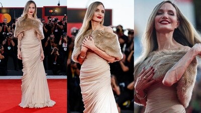 Angelina Jolie graces the Venice Film Festival 2024 in a Tamara Ralph ensemble, featuring a wrapped beige maxi gown paired with a matching fur cape. (Instagram) Angelina Jolie graces the Venice Film Festival 2024 in a Tamara Ralph ensemble, featuring a wrapped beige maxi gown paired with a matching fur cape. (Instagram)