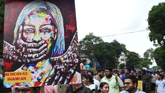 Junior doctors take part in a protest rally against the alleged sexual assault and murder of a postgraduate trainee doctor at R G Kar Medical College and Hospital, in Kolkata. (PTI)