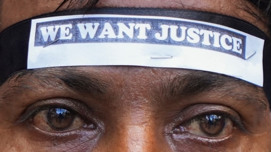 A Congress activist during a protest rally against the alleged rape and murder of a trainee woman doctor at RG Kar Medical College and Hospital in Kolkata. (PTI)
