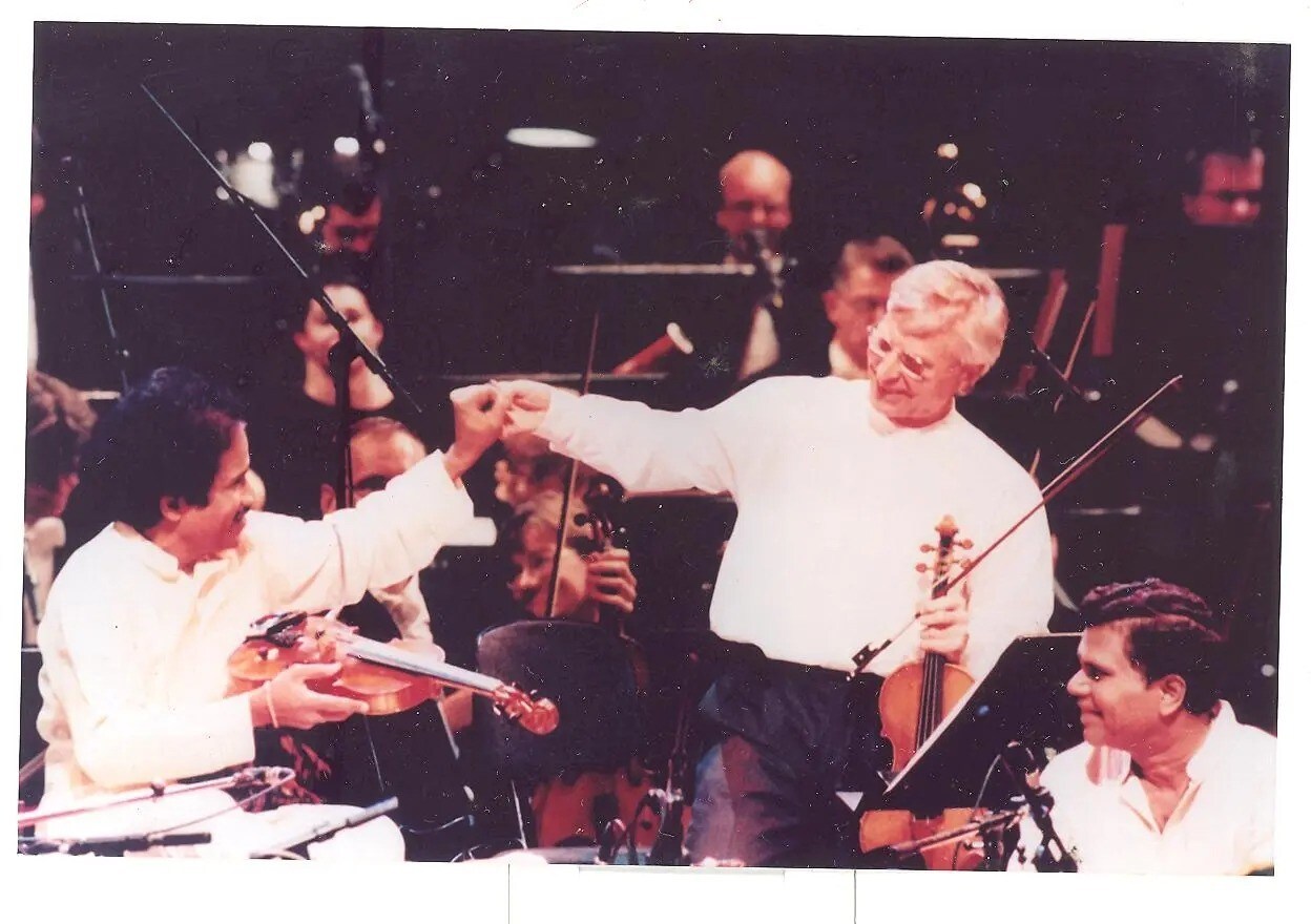 1986: With Norwegian violinist Arve Tellefsen (centre), after the Oslo Philharmonic performed one of his compositions. 1986: With Norwegian violinist Arve Tellefsen (centre), after the Oslo Philharmonic performed one of his compositions.