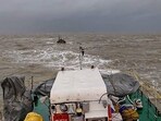 An Indian Coast Guard ship tows boat ‘Padmawati’ to safety after it drifted into the sea due to rough weather conditions off the Dwarka coast in Gujarat. (PTI Photo) An Indian Coast Guard ship tows boat ‘Padmawati’ to safety after it drifted into the sea due to rough weather conditions off the Dwarka coast in Gujarat. (PTI Photo)