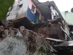 Due to the landslide in Vijayawada, heavy stones from the hillock crashed on the houses on Saturday. (HT Photo) Due to the landslide in Vijayawada, heavy stones from the hillock crashed on the houses on Saturday. (HT Photo)