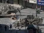 Israeli bulldozers move on a street during a military operation in the West Bank city of Jenin, Saturday, Aug. 31, 2024. (AP Photo/Majdi Mohammed)