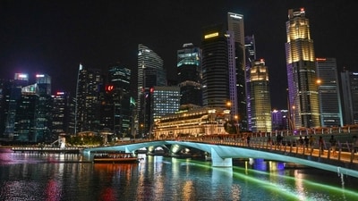 A general view shows the night time city skyline in Singapore on March 26, 2022 (Roslan Rahman/AFP) A general view shows the night time city skyline in Singapore on March 26, 2022 (Roslan Rahman/AFP)