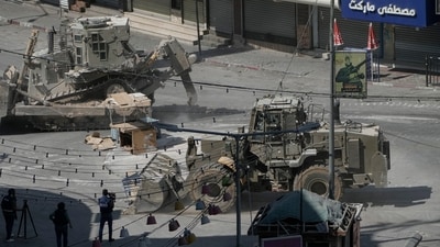 Israeli bulldozers move on a street during a military operation in the West Bank city of Jenin, Saturday, Aug. 31, 2024. (AP Photo/Majdi Mohammed) Israeli bulldozers move on a street during a military operation in the West Bank city of Jenin, Saturday, Aug. 31, 2024. (AP Photo/Majdi Mohammed)