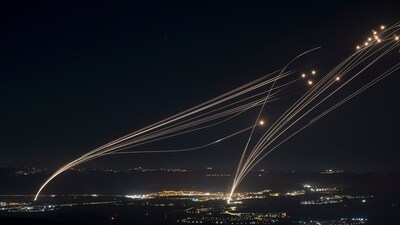 FILE - The Israeli Iron Dome air defense system fires to intercept an attack from Lebanon over the Galilee region as seen from the Israeli-annexed Golan Heights, Sunday, Aug. 4, 2024. (AP Photo/Leo Correa, File) (AP)