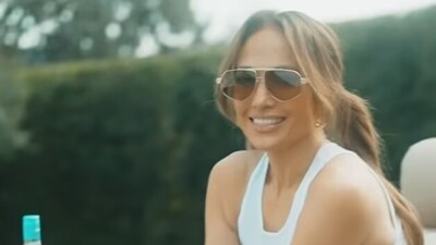 Jennifer Lopez can be seen in the video serving drinks to her pals and advertising her business Delola at the $68 million matrimonial house that she and her estranged husband listed for sale in early July. (Insta)