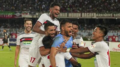 NorthEast United FC players celebrate after winning the Durand Cup on Saturday. (PTI)