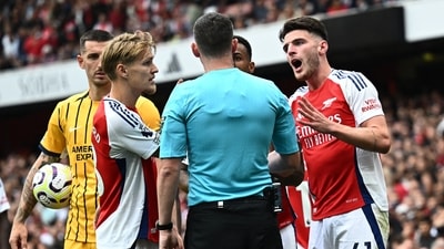 Arsenal's Declan Rice reacts after being shown a second yellow card before being shown a red card. (REUTERS)