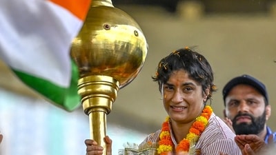 Wrestler Vinesh Phogat at Delhi's IGI airport. (RAJ K RAJ/HT) (RAJ K RAJ /HT PHOTO) Wrestler Vinesh Phogat at Delhi's IGI airport. (RAJ K RAJ/HT) (RAJ K RAJ /HT PHOTO)