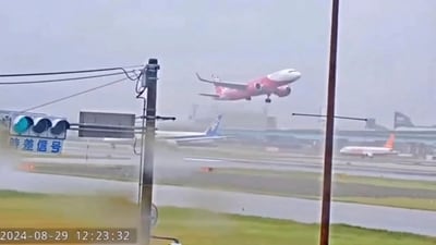 A plane takes off after a failed attempt to land, due to safety concerns following Typhoon Shanshan, in Hakata Ward, Fukuoka, Japan. (via REUTERS)