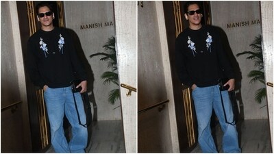 Vijay Varma's latest look is super stylish as he rocks a black sweatshirt adorned with a chic floral print. Paired with loose-fit jeans and black sunglasses, he looked effortlessly dapper. (HT photo/VarinderChawla) Vijay Varma's latest look is super stylish as he rocks a black sweatshirt adorned with a chic floral print. Paired with loose-fit jeans and black sunglasses, he looked effortlessly dapper. (HT photo/VarinderChawla)