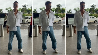 Akshay Kumar made a stylish appearance at the airport with an effortlessly casual look. He sported a white shirt with open buttons, one side casually tucked into his blue loose-fitted jeans. Paired with white sneakers and blue-tinted aviator sunglasses, he looked undeniably chic. (HT photo/VarinderChawla) Akshay Kumar made a stylish appearance at the airport with an effortlessly casual look. He sported a white shirt with open buttons, one side casually tucked into his blue loose-fitted jeans. Paired with white sneakers and blue-tinted aviator sunglasses, he looked undeniably chic. (HT photo/VarinderChawla)