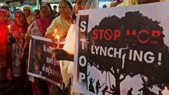 File Photo: Women hold placards and candles during a protest against the recent mob lynchings in India. (REUTERS/Amit Dave)