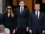 Former President Donald Trump, center right, stands with his wife Melania, second left, and their son Barron, center left, as the coffin carrying the remains of Amalija Knavs, the former first lady's mother, is carried into the Church of Bethesda-by-the-Sea for her funeral, Thursday, Jan. 18, 2024, in Palm Beach, Fla. 