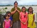 **EDS: SCREENGRAB VIA PTI VIDEOS** Khammam: A woman and children trapped on a rooftop appeal for help amid floods, in Khammam district, Sunday, Sep. 1, 2024. (PTI Photo) (PTI09_01_2024_000183A) **EDS: SCREENGRAB VIA PTI VIDEOS** Khammam: A woman and children trapped on a rooftop appeal for help amid floods, in Khammam district, Sunday, Sep. 1, 2024. (PTI Photo) (PTI09_01_2024_000183A)