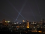 Ukrainian service personnel use searchlights as they search for drones in the sky over the city during a Russian drone strike, amid Russia's attack on Ukraine, in Kyiv, Ukraine August 29, 2024. REUTERS/Gleb Garanich
