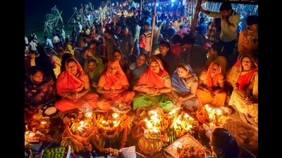 Devotees offer prayers on the ghats of River Yamuna, in Prayagraj (PTI File) Devotees offer prayers on the ghats of River Yamuna, in Prayagraj (PTI File)