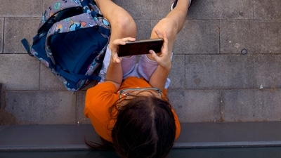 A 9-year-old child in Madhya Pradesh suffered severe injuries to his hand and thigh after a mobile phone exploded in his hand (Representational Image) (AP Photo/Emilio Morenatti) (AP) A 9-year-old child in Madhya Pradesh suffered severe injuries to his hand and thigh after a mobile phone exploded in his hand (Representational Image) (AP Photo/Emilio Morenatti) (AP)