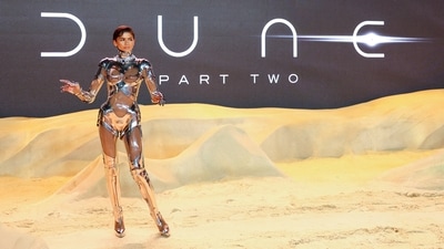 Zendaya's robotic ensemble exudes a futuristic vibe, but it's actually vintage Mugler from the brand’s Fall-Winter 1995 collection. The fembot-inspired bodysuit is crafted from shiny silver material and features clear cutouts on the breasts, midriff, arms, and legs. (REUTERS)