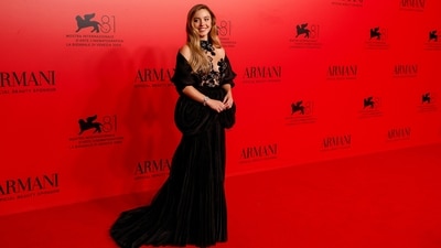 Sydney Sweeney opted for a romantic look at the Armani Beauty event during the 81st edition of the Venice Film Festival. She wore a stunning velvet gown featuring a sheer bust adorned with floral and sequin adornments, a pleated skirt, and a cascading train. (Joel C Ryan/Invision/AP) Sydney Sweeney opted for a romantic look at the Armani Beauty event during the 81st edition of the Venice Film Festival. She wore a stunning velvet gown featuring a sheer bust adorned with floral and sequin adornments, a pleated skirt, and a cascading train. (Joel C Ryan/Invision/AP)