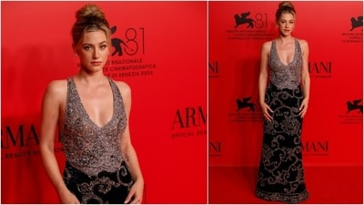 Lili Reinhart wore a bejewelled waistcoat and an embellished fitted skirt to the Armani event at the Venice Film Festival. She styled the ensemble with a soft makeup look, a messy top knot, and dainty jewels. (AP) Lili Reinhart wore a bejewelled waistcoat and an embellished fitted skirt to the Armani event at the Venice Film Festival. She styled the ensemble with a soft makeup look, a messy top knot, and dainty jewels. (AP)