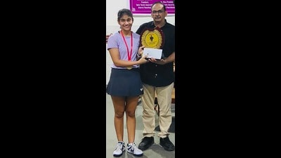 Nalin Somani, general secretary, Table Tennis Association, Panchkula, honouring paddler Manal. (HT Photo)
