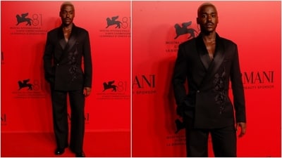 Ncuti Gatwa set the red carpet ablaze at Armani event held during the Venice Film Festival in a tailored black suit. He wore a single-breast floral embroidered blazer and straight-fit pants with black dress shoes. (AP) Ncuti Gatwa set the red carpet ablaze at Armani event held during the Venice Film Festival in a tailored black suit. He wore a single-breast floral embroidered blazer and straight-fit pants with black dress shoes. (AP)