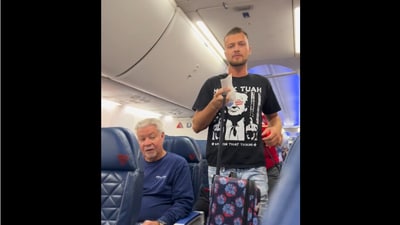 A man was booted off Delta airlines for wearing a graphic tee of Trump and a reference to the Hawk Tuah girl meme. (@ r/delta/Reddit) A man was booted off Delta airlines for wearing a graphic tee of Trump and a reference to the Hawk Tuah girl meme. (@ r/delta/Reddit)
