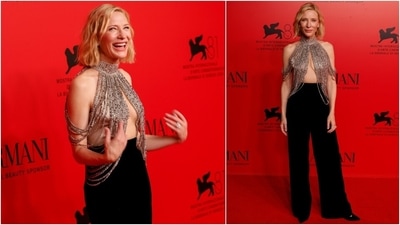 Cate Blanchett attended the Armani Beauty event at the Venice Film Festival in a dazzling ensemble featuring a jewelled cu-out blouse and high-waisted black flared pants. (AP) Cate Blanchett attended the Armani Beauty event at the Venice Film Festival in a dazzling ensemble featuring a jewelled cu-out blouse and high-waisted black flared pants. (AP)