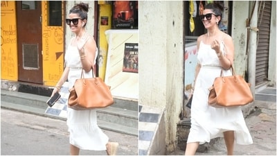 Nimrat Kaur embraced summer casuals in a sleeveless white cotton midi dress. The actor was the picture of comfort and elegance in the ensemble. She wore the outfit with sunglasses, a tote bag, bracelets, and earrings. (HT Photo/Varinder Chawla) Nimrat Kaur embraced summer casuals in a sleeveless white cotton midi dress. The actor was the picture of comfort and elegance in the ensemble. She wore the outfit with sunglasses, a tote bag, bracelets, and earrings. (HT Photo/Varinder Chawla)