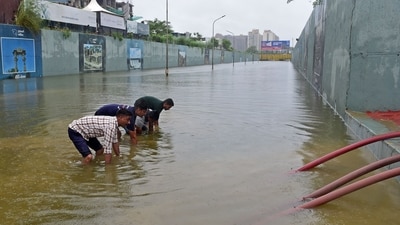 Rescue workers from the Gandhinagar Fire and Emergency Services effort to remove water from a flooded underpass after heavy rains on the outskirts of Ahmedabad (AFP) Rescue workers from the Gandhinagar Fire and Emergency Services effort to remove water from a flooded underpass after heavy rains on the outskirts of Ahmedabad (AFP)