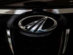 Mahindra & Mahindra share price: The logo of Mahindra and Mahindra is seen on a car at a showroom in Mumbai, India.