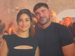 Zac Efron poses with a fan.