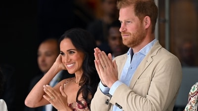 Britain's Prince Harry (C), Duke of Sussex, and his wife Meghan Markle react while attending a show during a visit to the National Centre for the Arts in Bogota on August 15, 2024 (AFP) Britain's Prince Harry (C), Duke of Sussex, and his wife Meghan Markle react while attending a show during a visit to the National Centre for the Arts in Bogota on August 15, 2024 (AFP)
