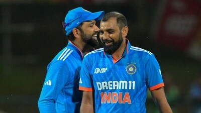 India's captain Rohit Sharma (L) with Mohammed Shami (AFP) India's captain Rohit Sharma (L) with Mohammed Shami (AFP)