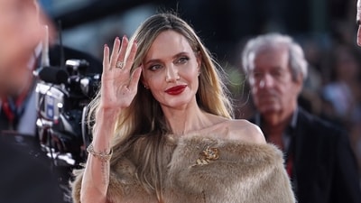 Angelina Jolie poses on the red carpet during arrivals for the screening of the movie Maria, in competition, at the 81st Venice Film Festival, Venice. (REUTERS)