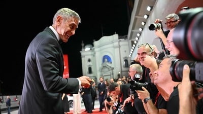 In order to lighten the mood, George made goofy faces on the red carpet, ensuring that the cameraperson get some excellent shots for his efforts. (AFP) In order to lighten the mood, George made goofy faces on the red carpet, ensuring that the cameraperson get some excellent shots for his efforts. (AFP)