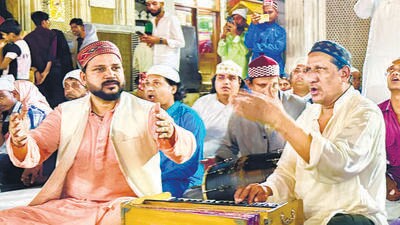 Now see the photo of the two qawwal singers snapped in the shrine’s courtyard a week ago. Chand Nizami, right, might be more familiar because of his appearance in a chartbuster film qawwali (you know which!). While the much younger Saqlain is the third son of the greatest qawwal of our times. (HT) Now see the photo of the two qawwal singers snapped in the shrine’s courtyard a week ago. Chand Nizami, right, might be more familiar because of his appearance in a chartbuster film qawwali (you know which!). While the much younger Saqlain is the third son of the greatest qawwal of our times. (HT)