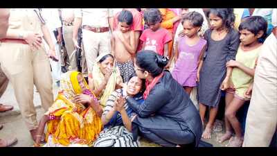 Officials of the district administration consoling distraught family members (HT Photo) Officials of the district administration consoling distraught family members (HT Photo)