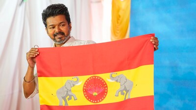 Chennai: Actor-turned-politician and Tamilaga Vettri Kazhagam President Vijay unveils party's flag at party headquarters, on the outskirts of Chennai, Thursday, Aug. 22, 2024. (PTI Photo/R Senthilkumar)(PTI08_22_2024_000028A) (PTI) Chennai: Actor-turned-politician and Tamilaga Vettri Kazhagam President Vijay unveils party's flag at party headquarters, on the outskirts of Chennai, Thursday, Aug. 22, 2024. (PTI Photo/R Senthilkumar)(PTI08_22_2024_000028A) (PTI)