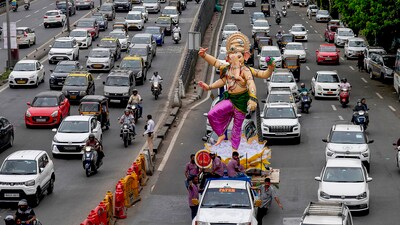 An idol of Lord Ganesha being transported ahead of Ganesh Chaturthi festival, in Mumbai. The fee for out-of-series numbers has risen to  ₹18 lakh. The first revision since 2013 also allows transferring VIP numbers to immediate family members. (PTI)