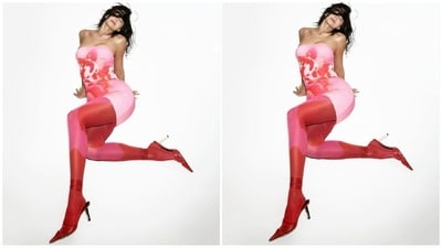 Kylie Jenner's most recent outfit showcases a stylish pink bodycon dress with an off-shoulder neckline and a bold red abstract print. Paired with skin-tight matching leggings and red tie-up heels, she looks absolutely stunning. (Instagram/@kyliejenner) Kylie Jenner's most recent outfit showcases a stylish pink bodycon dress with an off-shoulder neckline and a bold red abstract print. Paired with skin-tight matching leggings and red tie-up heels, she looks absolutely stunning. (Instagram/@kyliejenner)